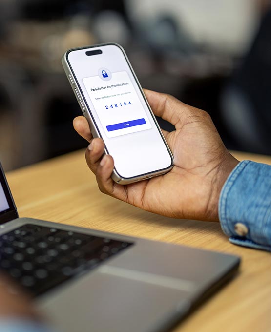 Person holding a phone with security notification