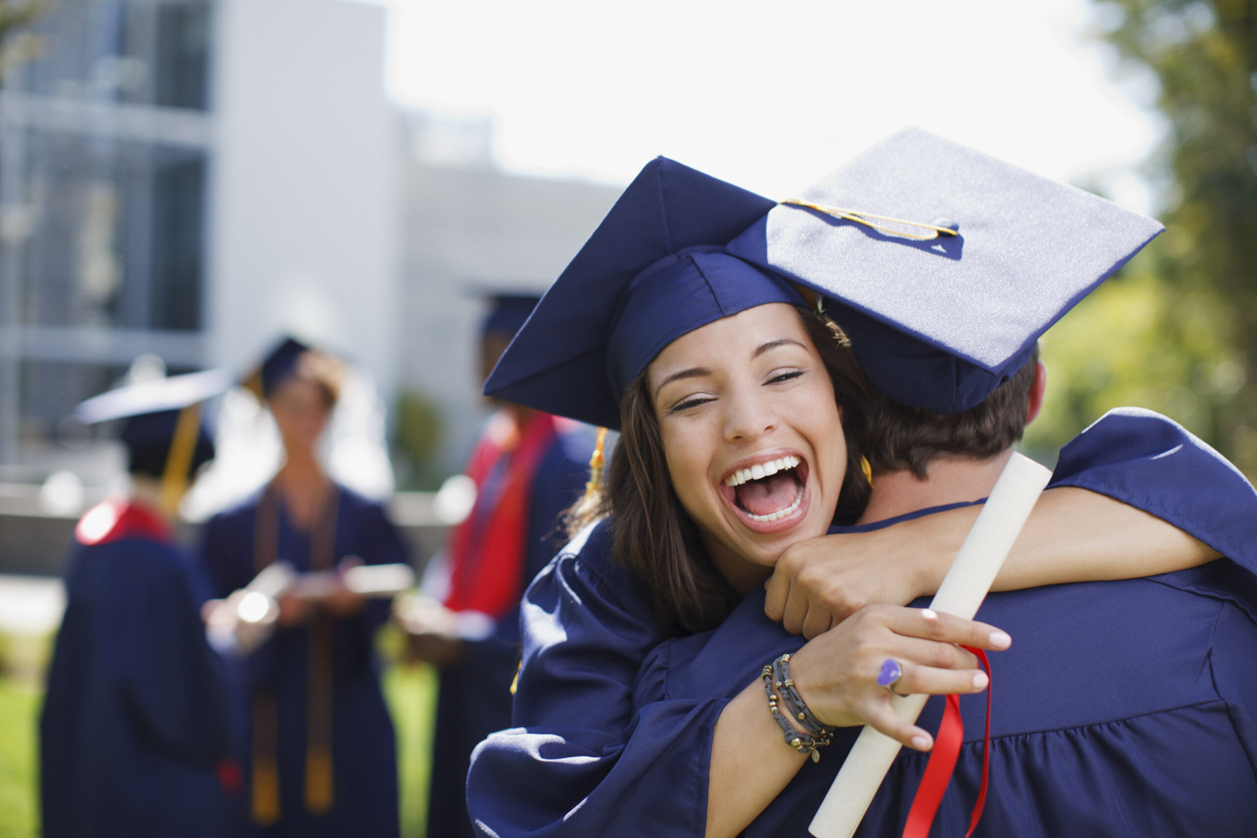 woman in cap and gown with degree