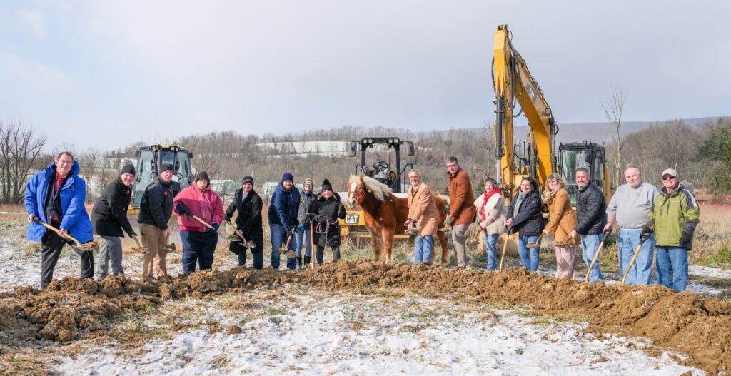 groundbreaking ceremony in the cold with a horse