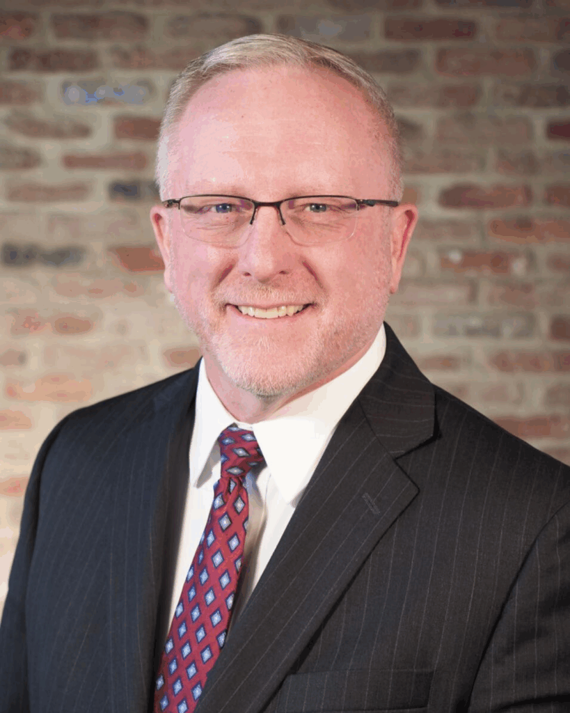 man in black suit jacket with red tie