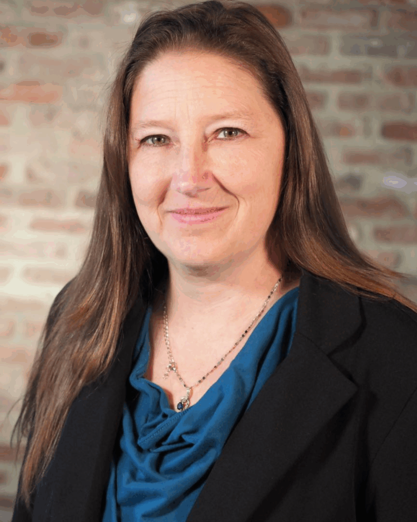 woman in blue shirt with black jacket